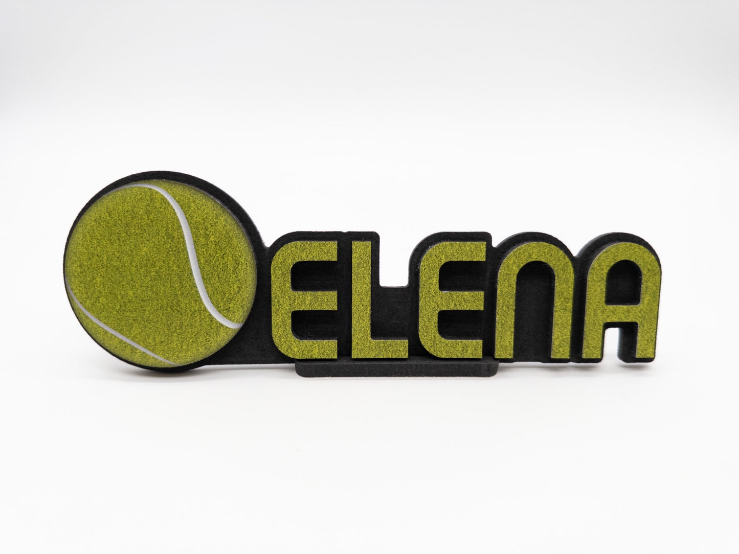 Front view of a personalized desk name plate with the name 'Elena' and a tennis ball design, perfect for sports enthusiasts."