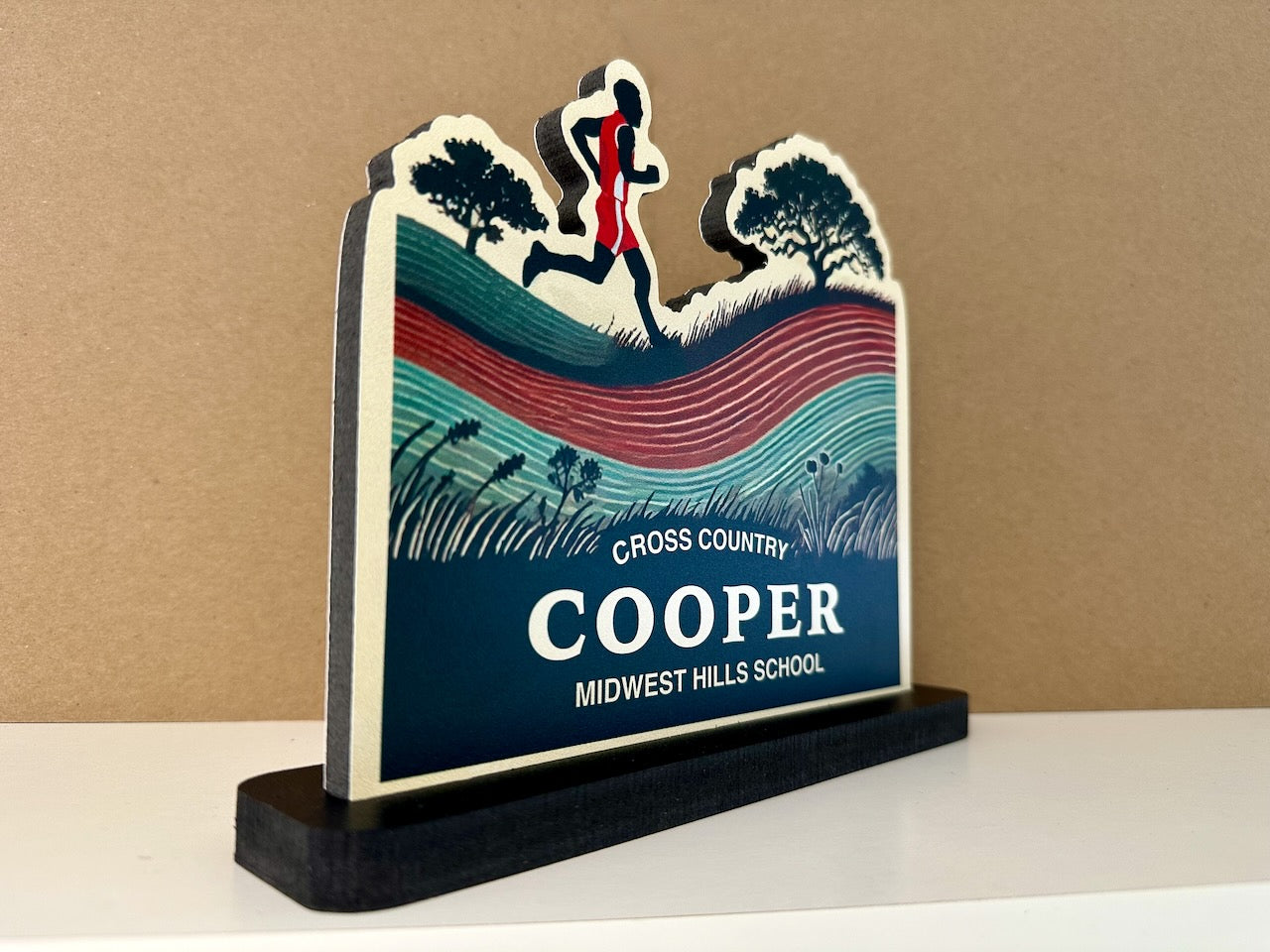 Side view of custom cross country sign with male runner silhouette, name Cooper, and Midwest Hills School displayed.