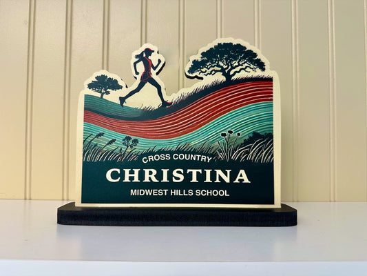 Cross-country runner desk name plate with a female athlete design, displaying the school name.