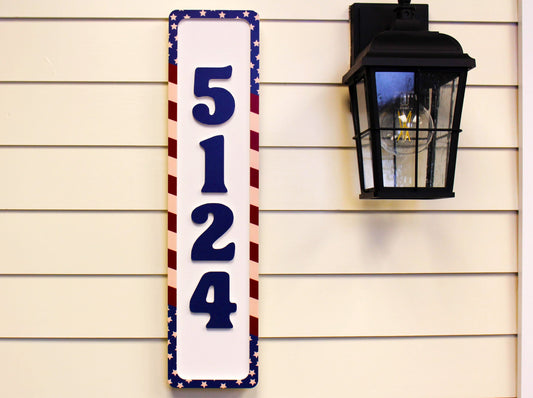 Patriotic vertical house number sign with red, white, and blue stars and stripes border.