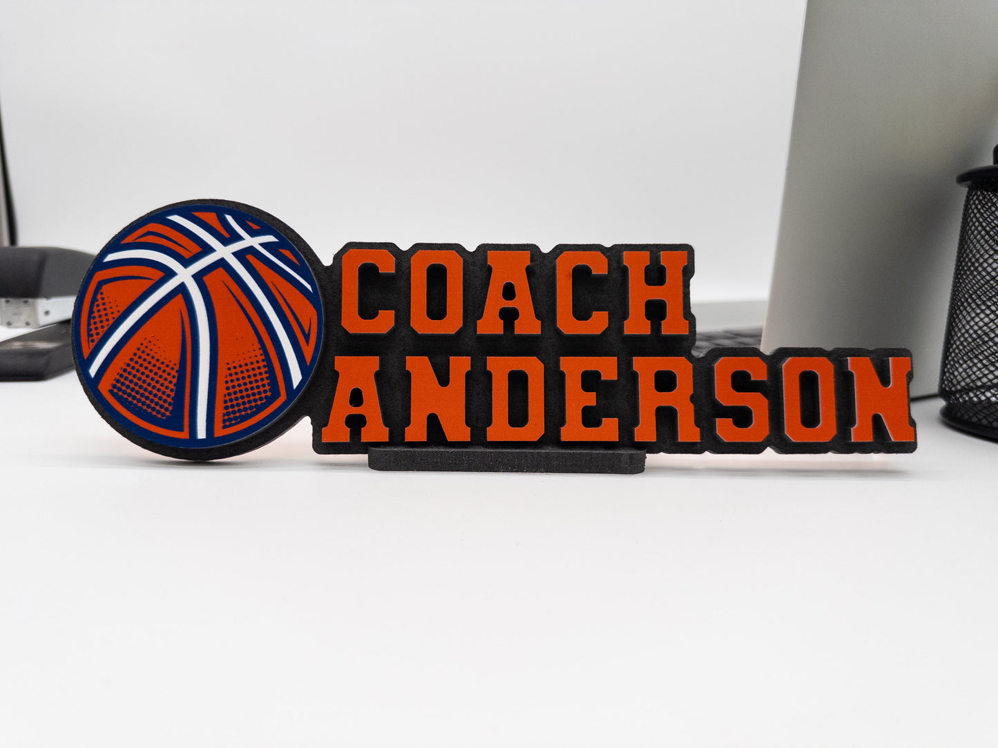 Customized desk nameplate for Coach Anderson with a basketball motif, perfect for adding a personal touch to an office.